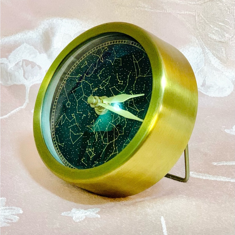 Modern Gold and Black Wall Clock with Minimalist Design